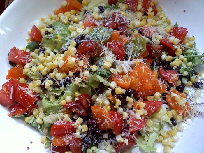 Salad with corn, tomatoes, black beans, and parm.